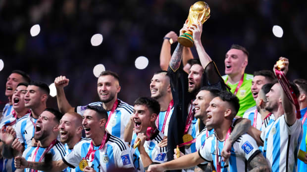 Lionel Messi lifting the World Cup trophy.